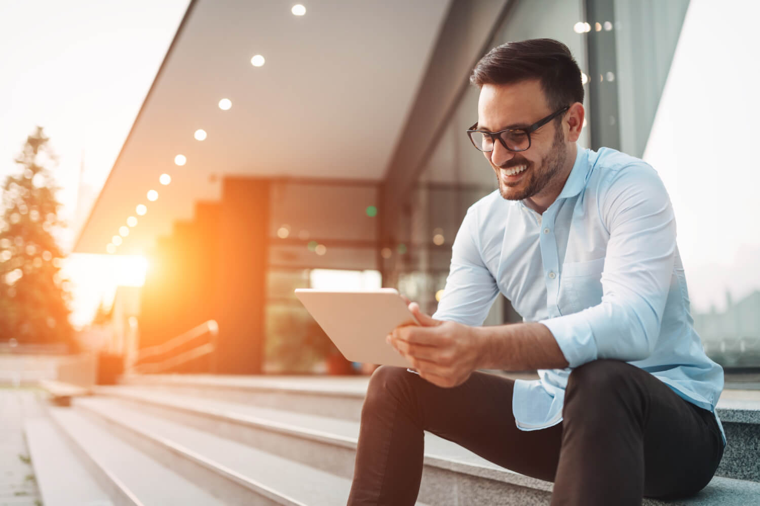 Brisbane homeowner reviewing bridging loan application on a tablet at sunset